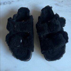 Brand NEW Black Sherpa Birkenstocks. Never worn sz. 39.